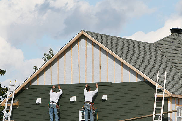 Professional Vinyl Siding technician working in Maynard, MA